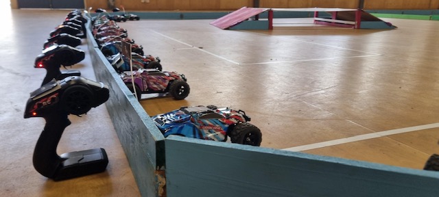 Team cheering as car crosses finish line